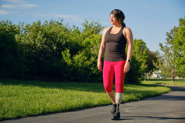 istock Woman with Prosthetic Leg in a Park 1495168335