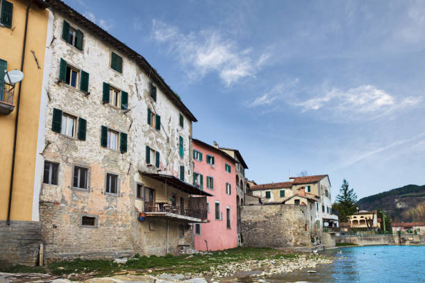 istock Santa Sofia, Forli Cesena, Emilia Romagna, Italy: view of the old town from the river shore with the ancient houses and the Apennine mountains on background 1495168668