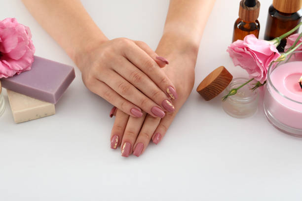istock Concept of hand care with cosmetics on white background 1495174203