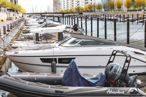 Motor boat or yacht is charging at the pier, Copenhagen Denmark- June 3, 2023