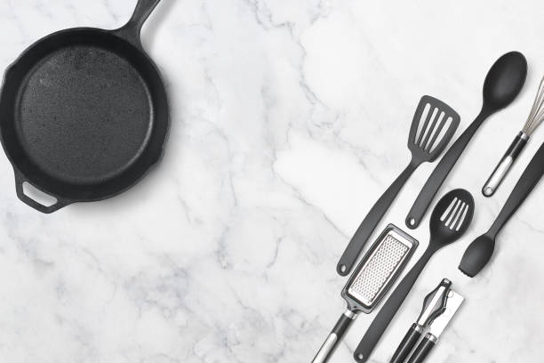 istock Kitchen utensils and a cooking pan on a marble stone background 1495176185