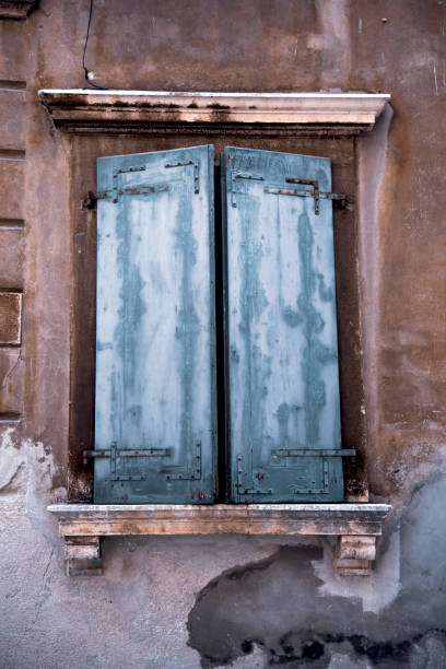 Old Window with Wooden Shutters Closed stock photo