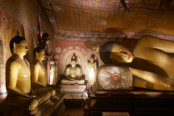 Ancient statues and artwork inside the Buddhist caves at Dambulla in Sri lanka stock photo