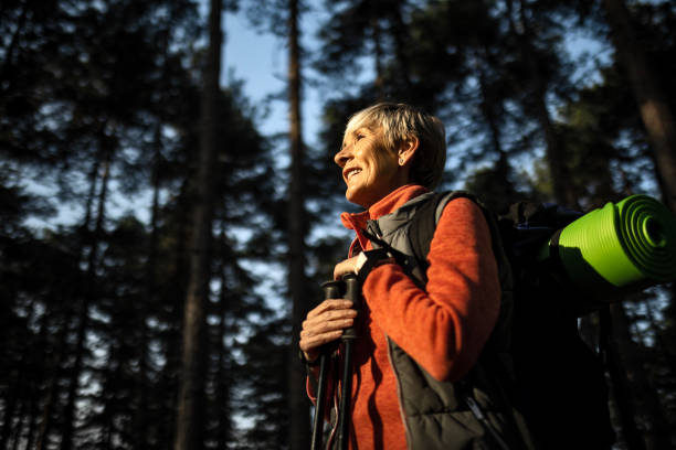 istock Smiling mature woman hiking 1495180744