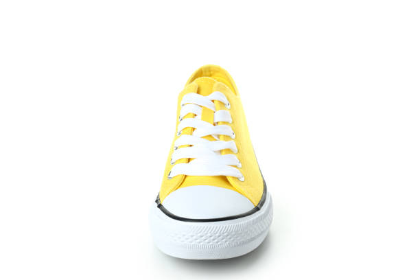 istock One yellow sneaker isolated on white background 1495182942