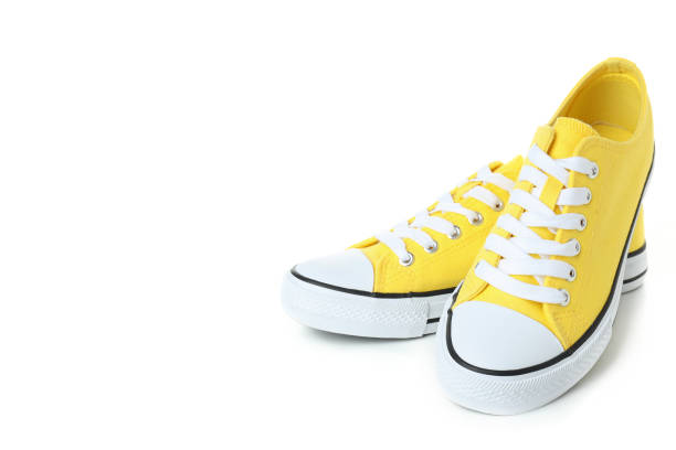 istock Pair of yellow sneakers isolated on white background 1495183930