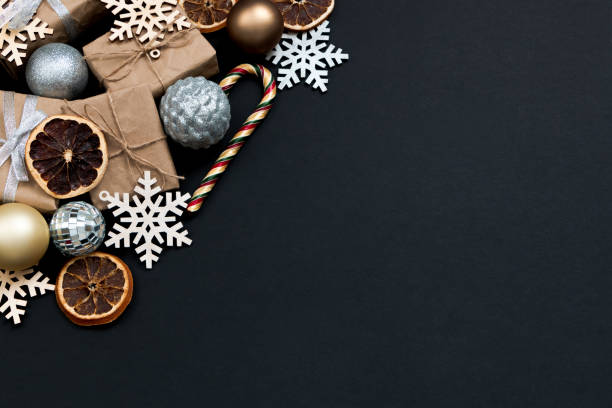 istock Beautiful Christmas golden silver decorations on a dark black background. Flat design, postcard, calendar, banner. Place for text. 1495186140