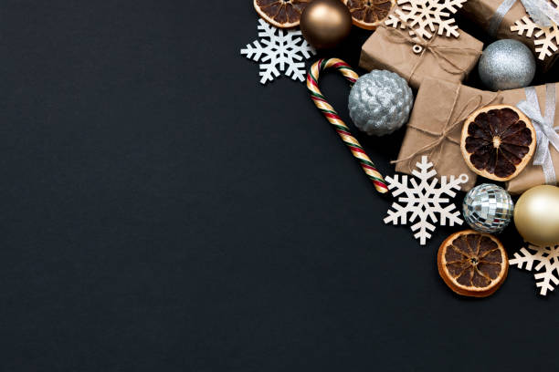 istock Beautiful Christmas golden silver decorations on a dark black background. Flat design, postcard, calendar, banner. Place for text. 1495186228