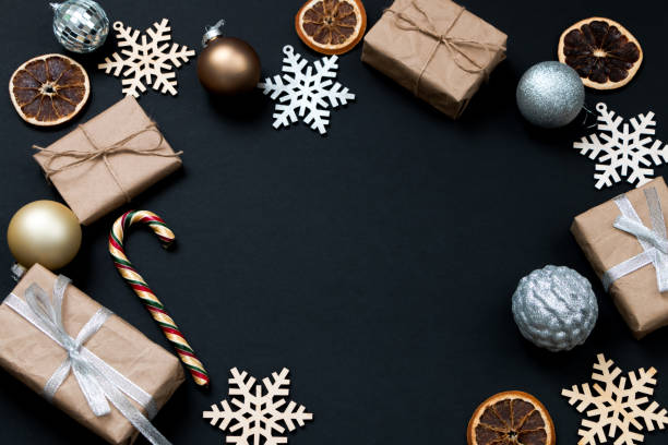 istock Beautiful Christmas golden silver decorations on a dark black background. Flat design, postcard, calendar, banner. Place for text. 1495186332