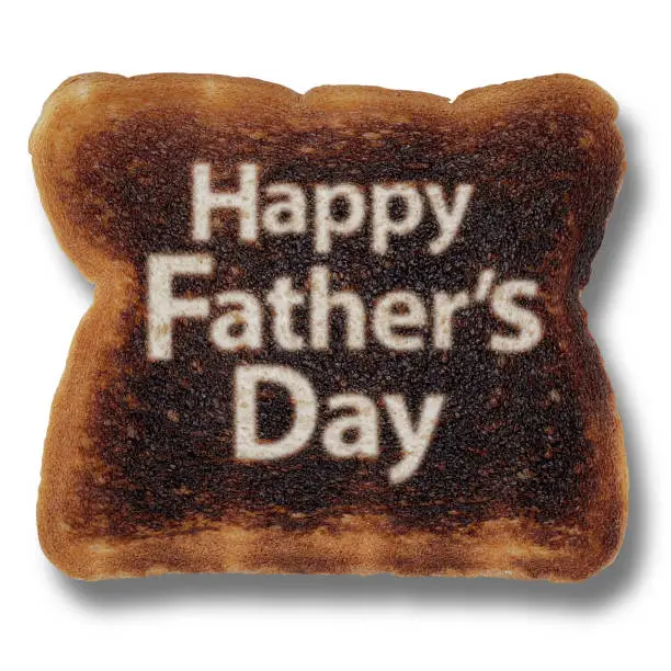 Fathers Day funny design symbol as aburnt toast with holiday celebration and paternal symbols for dad or daddy honoring papa as a cook for parenthood and fatherhood parenting.