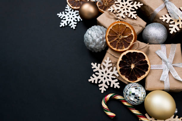 istock Beautiful Christmas golden silver decorations on a dark black background. Flat design, postcard, calendar, banner. Place for text. 1495186629