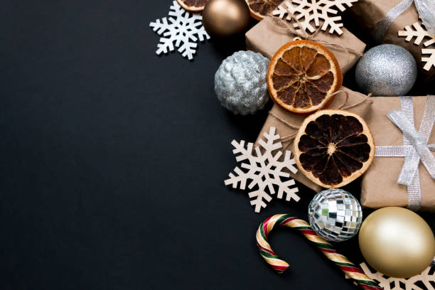 istock Beautiful Christmas golden silver decorations on a dark black background. Flat design, postcard, calendar, banner. Place for text. 1495186737