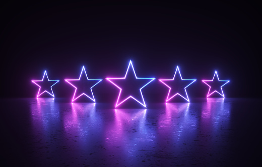 Glowing star shapes before dark background. Horizontal composition.