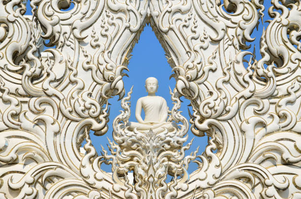 White Buddha statue with detailed frame in White Temple. Thailand Chiang Rai - Wat Rong Khun