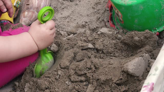 Child playing in the sandbox