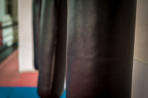 Modern gym facility in Bangkok, boxing gloves close up.