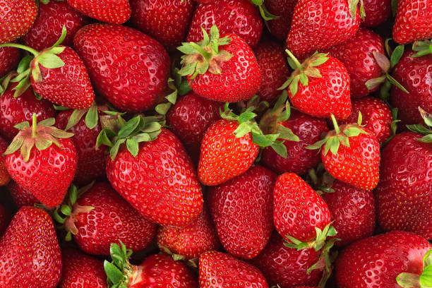 istock Background from freshly harvested strawberries, top view. Food background. 1495189058