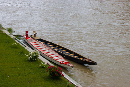 Two empty canoe boats on the  river