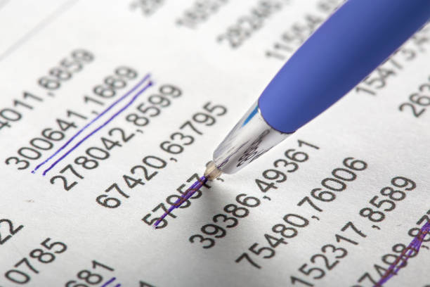 istock Checking the value of securities. Pen, share listing and checking financial chart. Concept of banking, financial report and financial audit. 1495191340
