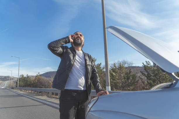 istock Vehicle breakdown, calling car insurance service 1495191437