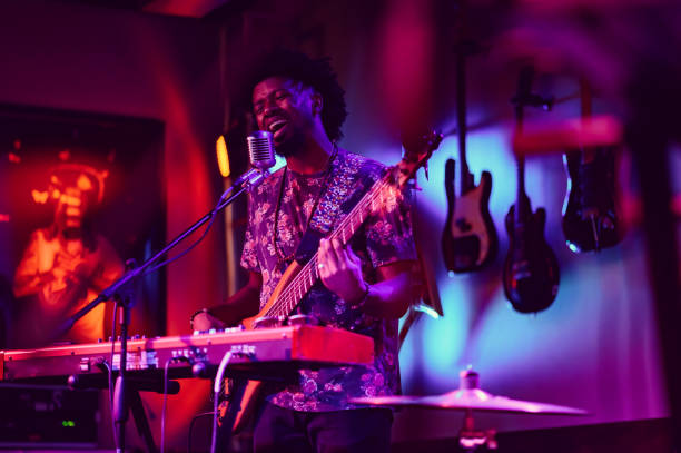 istock Musician performing on stage with guitar 1495193928