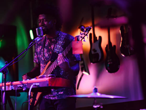 istock Musician performing on stage with guitar 1495193935
