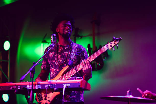 istock Musician performing on stage with guitar 1495194089