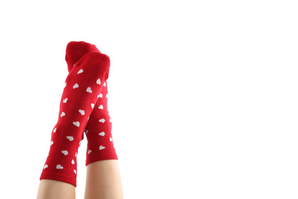 I'm dressed a little weird, with colorful socks and old-fashioned sandals, in my home, with a terracotta tiled floor