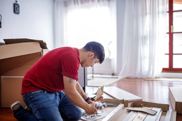 istock Young man assembling furniture 1495195381