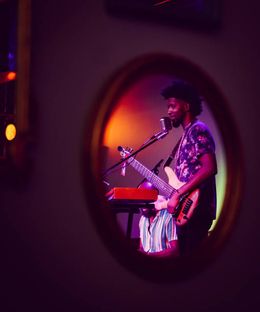 istock Musician performing on stage seen in reflection 1495198917
