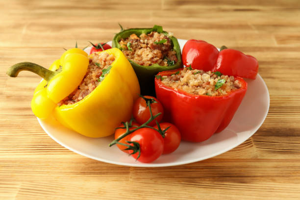 istock Stuffed pepper in plate on wooden background 1495201374