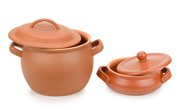 istock Two clay pots with lids isolated on white 1495205251