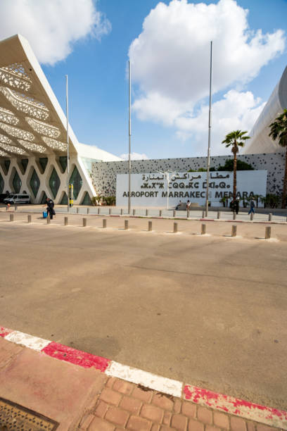 Marrakesh Menara Airport at Marrakesh-Safi, Morocco Incidental people near the place sign for Marrakesh Menara Airport at Marrakesh-Safi, Morocco marrakesh safi photos stock pictures, royalty-free photos & images