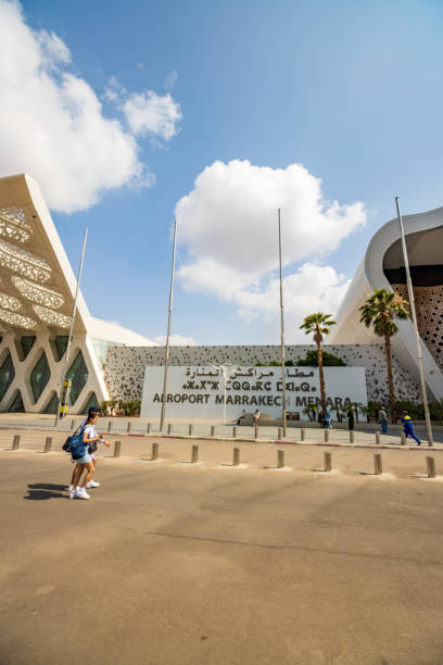 Marrakesh Menara Airport at Marrakesh-Safi, Morocco A couple walking near the place sign to Marrakesh Menara Airport at Marrakesh-Safi, Morocco marrakesh safi photos stock pictures, royalty-free photos & images