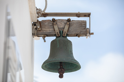 Milk can and a bell hanging at it