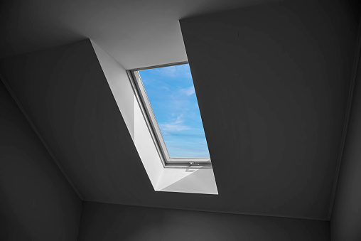 Interior view from a new roof window. Dormer window.