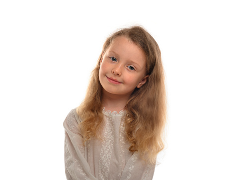 Smiling 10 y.o. girl isolated on white. 