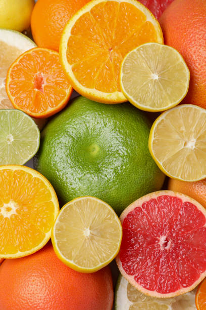 istock Different citrus fruits as background, top view 1495217581