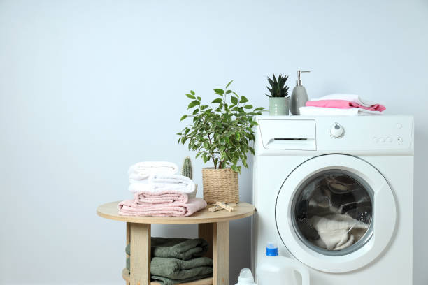 istock Concept of housework with washing machine on white background 1495221913