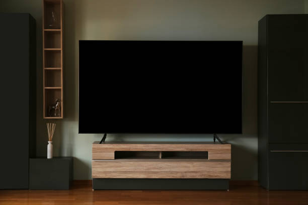 istock Modern TV set on table in room. Interior design 1495222999