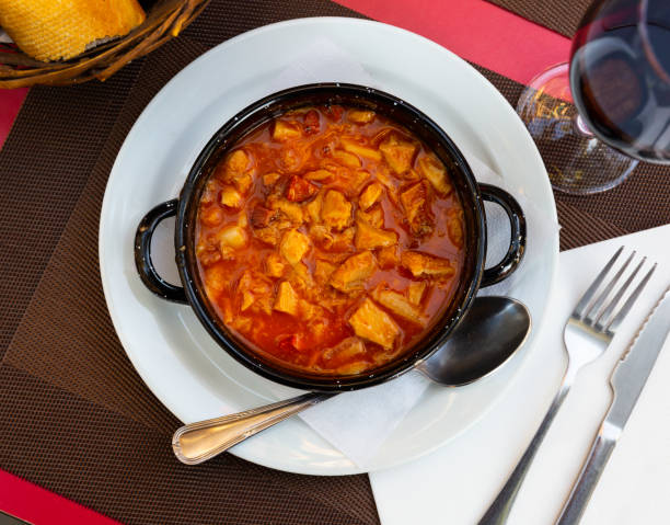 Delicious braised tripe served with chorizo and chickpeas in bowl