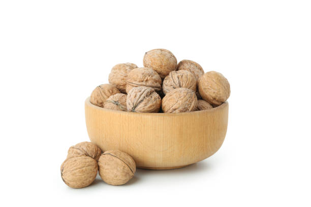 istock Walnuts in bowl isolated on white background 1495230249