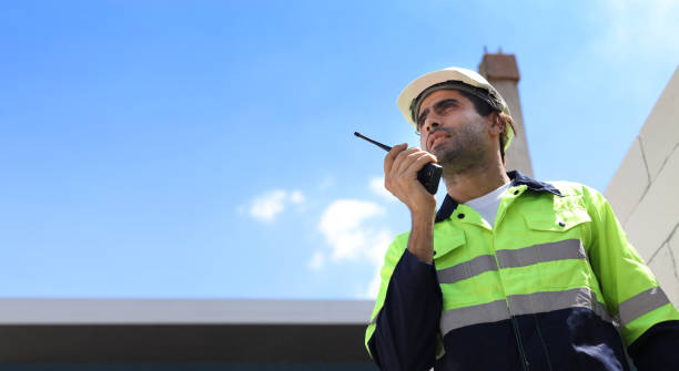 istock Technician civil engineer or specialist inspector discussing, brainstorm and planing real estate project work with smart mobile phone and tablet at Industrial building site. Construction concept 1495230787