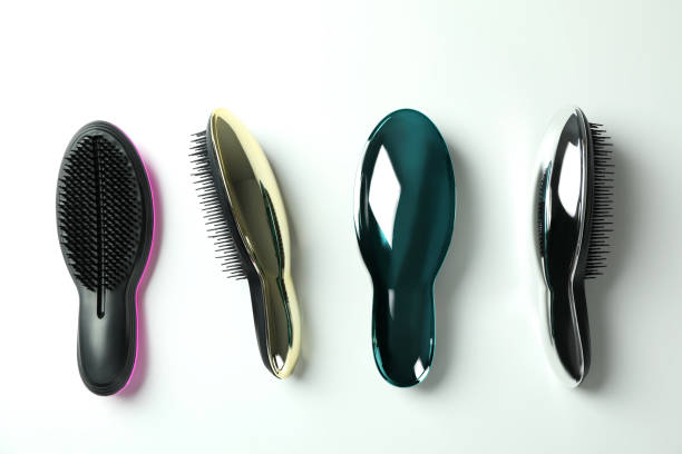 istock Colored plastic hair brushes on white background 1495231672