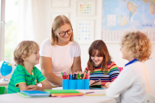 istock Kids in school. Children in class. 1495231883