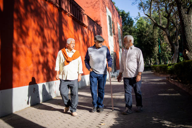 istock Three senior Latin friends walking outdoors 1495233617