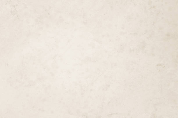 istock Colour old concrete wall texture background. Close Up retro plain cream color cement wall background texture. Design paper vintage parchment element show or advertise or promote product on display. 1495237462