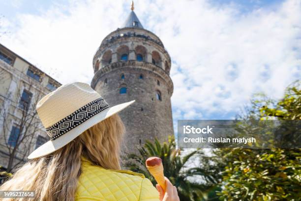 Beautiful Young Tourist Girl In Fashionable Clothes Poses With View Of Landmark Galata Tower In Beyogluistanbulturkeytraveler Concept Image Stock Photo - Download Image Now
