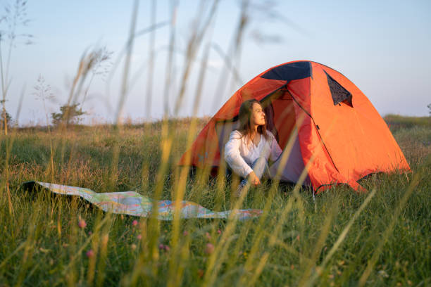 istock Eco mind. Woman camping in nature. 1495238140