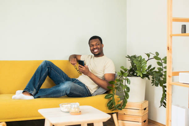 istock Shot of a young man using his smartphone 1495242185